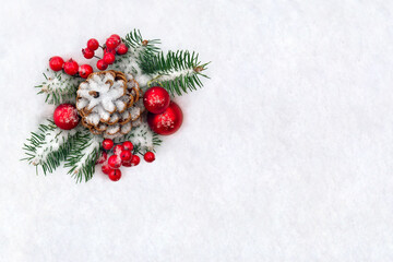Wall Mural - christmas decoration. cone pine, branches christmas tree, red ball, red berries on snow with space f