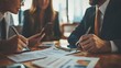 © Keattipoom - Business Deal Sealing with Signed Documents in Office