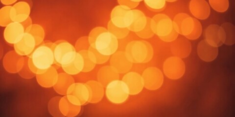 Abstract orange bokeh background with soft and blurred lights, festive