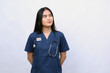© ArvStd - Hispanic nurse in uniform with stethoscope dreaming of achieving goals and purposes