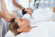© InfiniteFlow - Caucasian couple enjoying relaxing anti-stress head massage and pampering facial beauty skin recreation leisure in dayspa modern light ambient at luxury resort or hotel spa salon. Quiescent