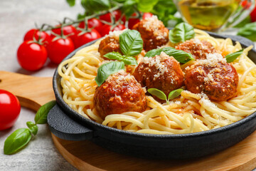 Wall Mural - Delicious pasta with meatballs and ingredients on light grey table, closeup