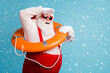 © deagreez - Portrait of his he attractive cheerful cheery dreamy white-haired Santa swimmer sailor wearing safe lifesaver search look far away horizon isolated bright vivid shine vibrant blue color background