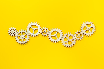 Top view of gears connected together as a symbol of teamwork and business automation