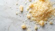 © AlfaSmart - Close-Up of Grated Parmesan Cheese on White Background