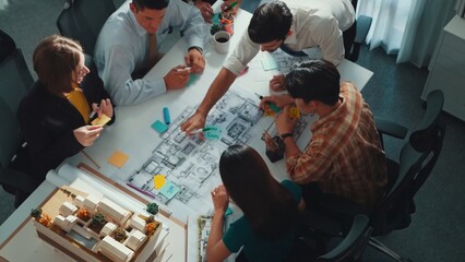 Poster - Group of diverse team planning strategy while sitting at table with project plan. Top aerial view of smart business people working together to brainstorm and design house construction. Alimentation.