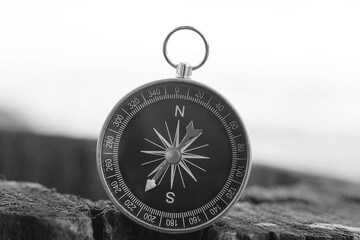 Wall Mural - classic navigation compass on natural background