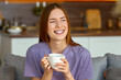 © kucherav - Happy Woman Enjoying Coffee at Home