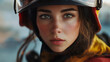 © Alexander - Close-up portrait of a female firefighter wearing protective gear, including a helmet and respirator mask