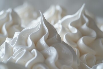 Poster - Close up of white meringue peaks forming swirls with a smooth texture