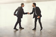 © peopleimages.com - Above, business people and men with welcome, handshake and partnership with onboarding. Employees, hello or b2b deal with cooperation for project, negotiation or collaboration with thank you in lobby