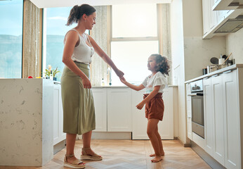 Wall Mural - Dance, smile and mother with daughter in kitchen for support, energy and music. Happiness, love and freedom with woman and child bonding in family home for fun, playful and entertainment together