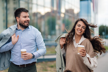 Wall Mural - Business people walking and talking during coffee break