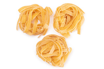 Three Classic Italian Raw Egg Fettuccine - Isolated on White Background. Dry Twisted Uncooked Pasta. Italian Culture and Cuisine. Raw Golden Macaroni Pattern - Isolation