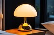 © Sanchai - Hand turning on a soft bedside lamp in the early morning, creating a calm and comfortable atmosphere