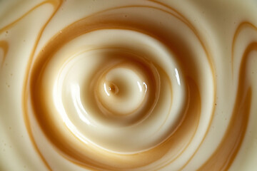 Fototapete - mesmerizing swirl of creamy milk and caramel creates captivating vortex pattern, evoking sense of motion and fluidity