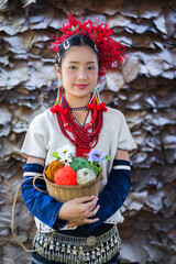 Fashion Portrait of Pretty Asian Lua Tribe Woman Dress. Beautiful girl in traditional Lua Tribe Girl costume on the mountain of Chiang Mai, Thailand.  Lua is Indigenous ethnic group in Asia.