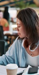 Poster - Research, writing and books with Asian woman in cafeteria for studying, paperwork and college. University, learning and education with person on school campus for knowledge, future and reading