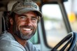© ASGraphicsB24 - Smiling bearded man in a baseball cap, inside a truck cab.