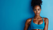 © Kevin - Fit Woman in Blue Activewear with Defined Abs