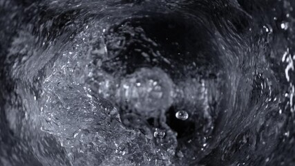 Wall Mural - super slow motion shot of water whirling in glass bottle at 1000fps.