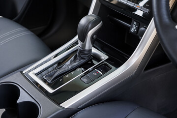 automatic transmission shift selector in the car interior. Closeup a manual shift of modern car gear shifter. 4x4 gear shift