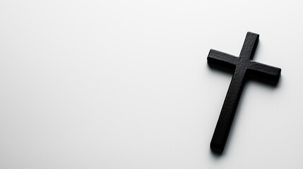 Black wooden cross on white isolated background.