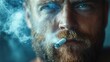 © BloomArt - Close-up portrait of a man smoking a cigarette, with smoke billowing out from his mouth.