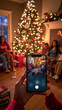 © OLHA - A person taking a picture of a family in front of a Christmas tree