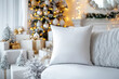© Olga - White blank square throw pillow mockup, cozy Christmas themed decor in background