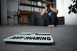 © New Africa - Stop body shaming. Depressed overweight man and floor scales indoors, selective focus