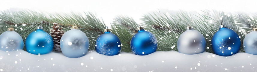 Wall Mural - blue christmas balls in a row with spruce branches covered with snow and snowfall on white backgroun