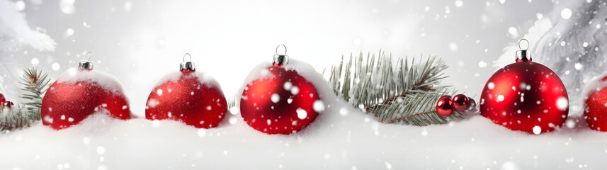 Wall Mural - red christmas balls, baubles, pine cones and spruce branches in a row covered with snow on white bac