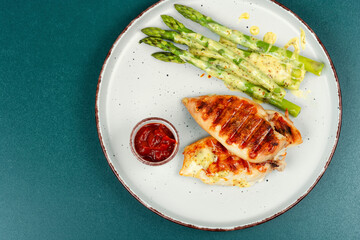 Wall Mural - Grilled chicken fillet with asparagus, healthy keto.