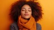 © Aliaksandr Siamko - Beautiful woman with scarf on warm orange background