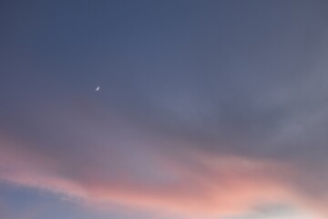 Wall Mural - half moon on twilight blue and orange sky in evening