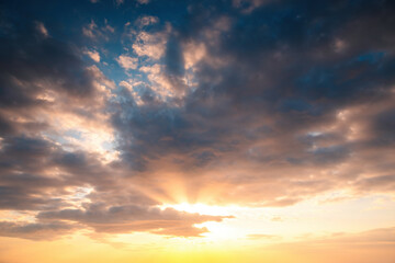 Wall Mural - sunset dramatic sky clouds with sunbeam