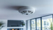 ©  Dreamy Shots - Smart home smoke detector ceiling installation, modern white fire alarm, home safety device close-up, interior with blurred background, technology for security, fire prevention