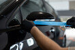 © alones - professional man tapes a car with masking tape before polishing. Preparation before polishing