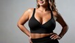© Animaflora PicsStock - young  woman with big bust size in black sportswear close up