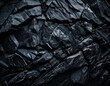 © Piyanat - Dark Stone Texture: Abstract background image of rough, fragmented black stones, ideal for design projects needing a strong, dramatic, and textured aesthetic.
