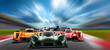 © stockphoto-graf - View on pack of colorful Pack or group  of  hypercar endurance 24h race cars with green leading  on  modern race track packed with fans. Fast dynamic thrilling motorsport and background concept.