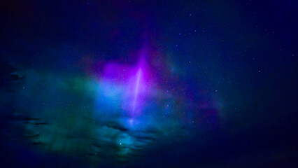 Wall Mural - northern lights dancing over dark space in north of sweden.