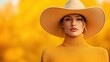 © Vasiliy - Woman in yellow turtleneck and beige hat against yellow background. Autumn fashion concept