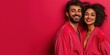 © Vasiliy - Couple in red bathrobes with curly hair against pink wall. Valentine's Day romance concept