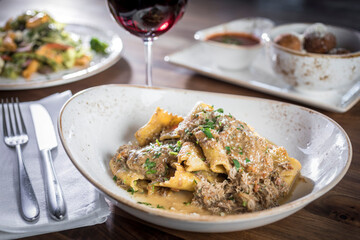 Pappardelle pasta with braised meat dish with red wine