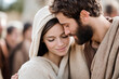 © PhotoGranary - Tender moment between a man and woman in historical attire, evoking the biblical figures of Mary and Joseph, symbolizing love, faith, and unity.