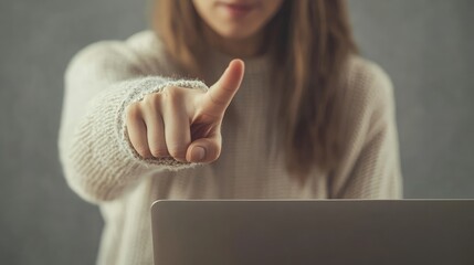 Poster - A woman in a cream sweater points to her laptop screen, emphasizing a key point.
