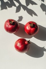 Canvas Print - Pomegranates on White Surface