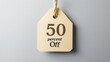 © SB4 GM - Isolated shopping tag with 50 percent Off on a neutral backdrop, representing big Black Friday discounts